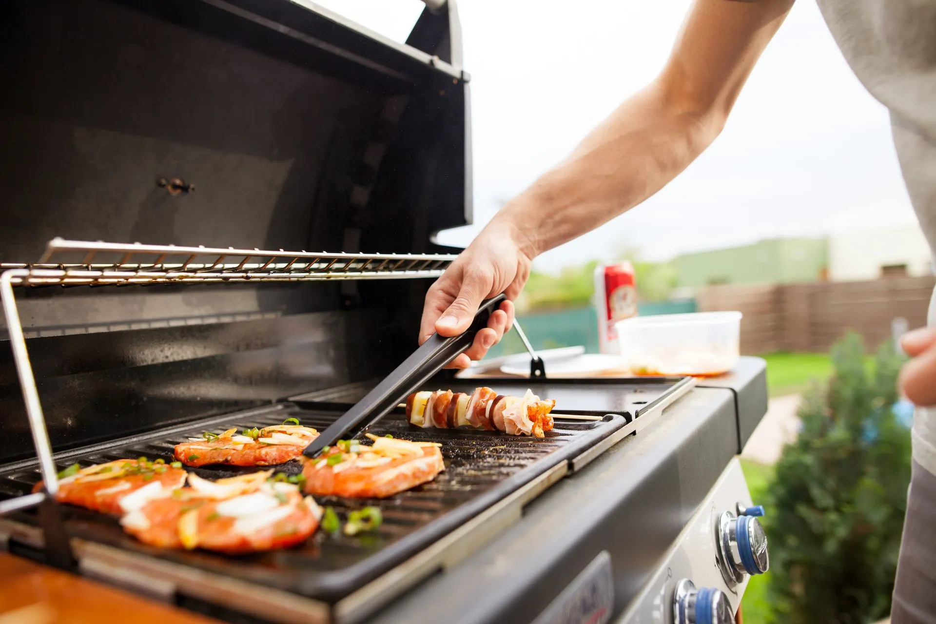 Food cooking on a propane grill