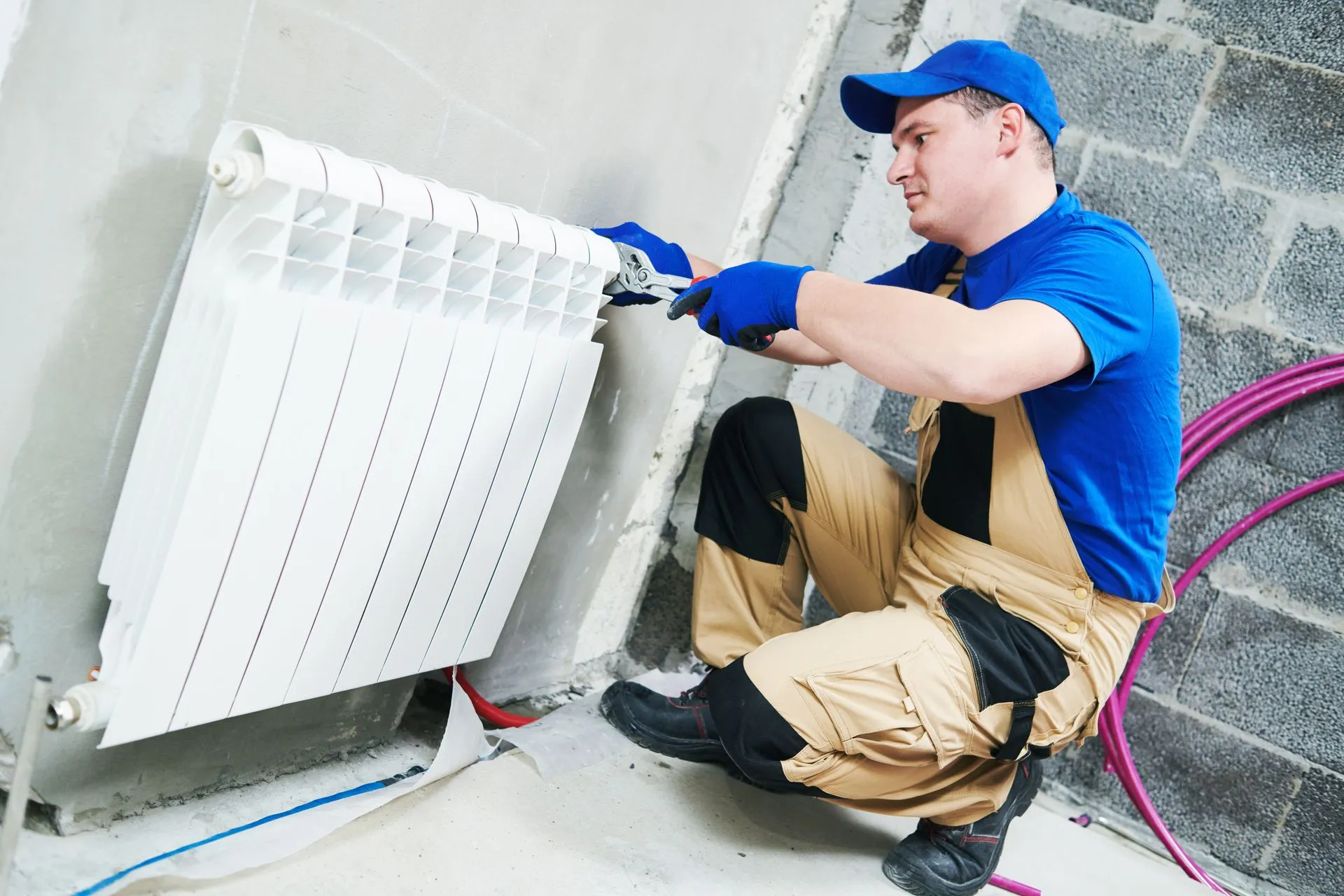 Technician installing a home heating unit